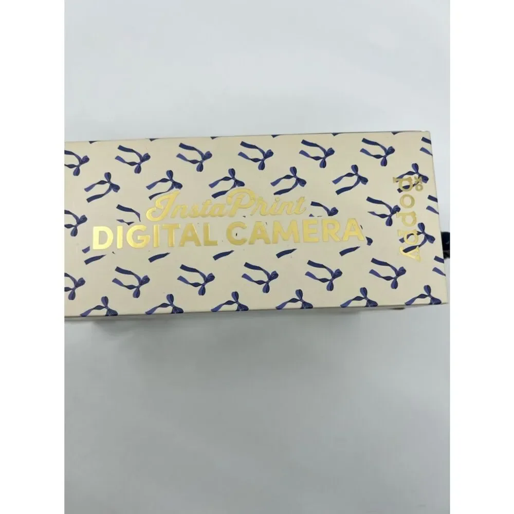 NIB XO Poppy White Digital insta-print Camera with Blue ribbon Accents
